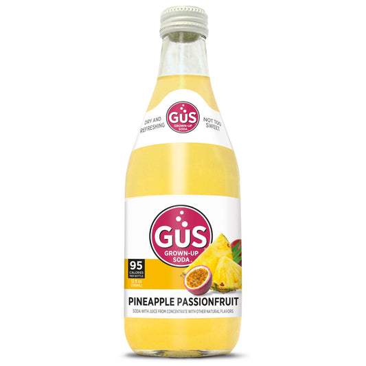 A bottle of GUS Pineapple Passionfruit Craft Soda on a white background