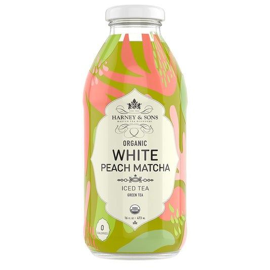 A bottle of Harney & Sons Organic White Peach Matcha Iced Tea, displaying a colorful label with peach and green hues.