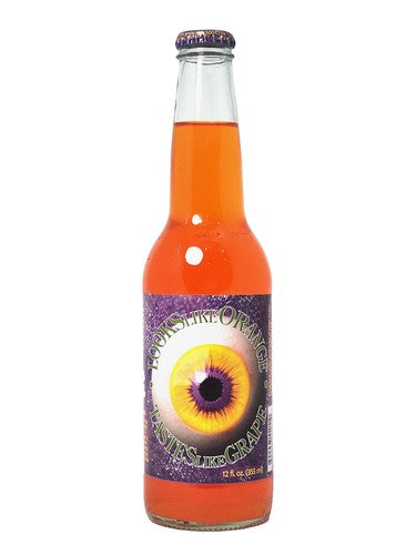 Bottle of orange soda with a purple label featuring an eye design on a white background