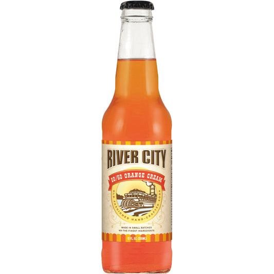 A glass bottle of River City orange cream soda with a label showing the brand name and the words 'Orange Cream Soda'.