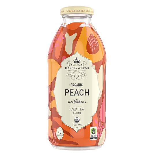 Bottle of Harney & Sons Organic Peach Iced Tea on a white background