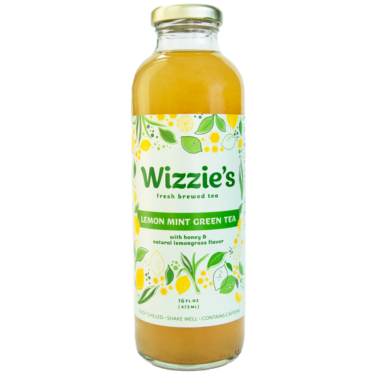 Glass Wizzie's Lemon Mint Green Tea bottle with lemons, limes and honeygrass on a white label.